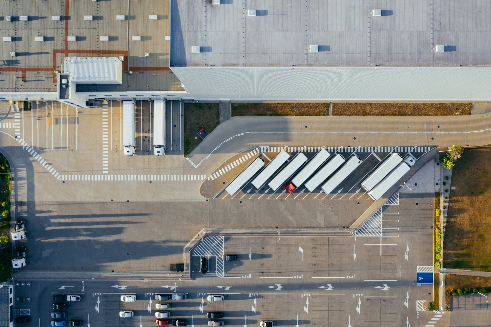 Aerial view of a distribution centre with lorries at loading bays